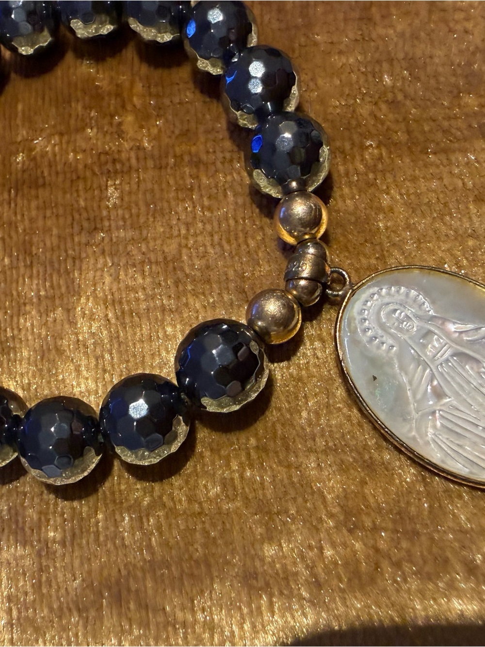 Faceted Black Bead Bracelet with Religious Pendant